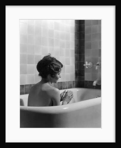 1920s 1930s woman sitting in bath tub by Anonymous