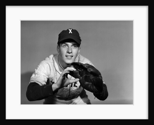 1950s baseball player with glove poised to catch ball keeping his eye on the ball by Anonymous
