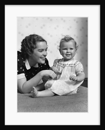 1930s smiling mother and happy child looking at camera by Anonymous