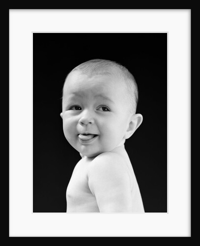 1940s 1950s baby head & shoulders smiling sticking out tongue by Anonymous