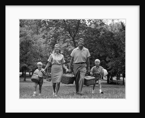 1960s family picnic walking toward looking at camera by Anonymous