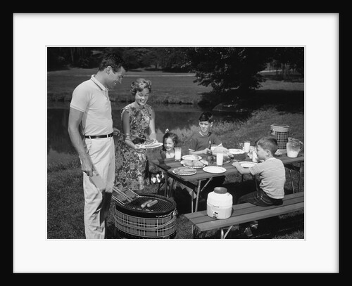 1950s family picnic bar-b-cue mom dad children by Anonymous