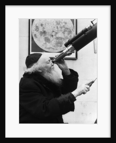 1930s old astronomer white hair and beard wearing skull cap looking through telescope by Anonymous