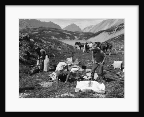 1920s 1930s three men cowboys at campsite preparing food horses in background alberta canada by Anonymous