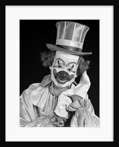 1950s portrait of clown wearing top hat smiling looking at camera by Anonymous
