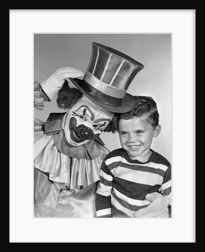1950s smiling clown with top hat arm around grinning boy in striped shirt by Anonymous