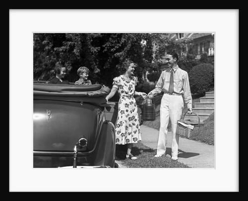 1930s family of four getting into convertible automobile with picnic basket and thermos jug by Anonymous