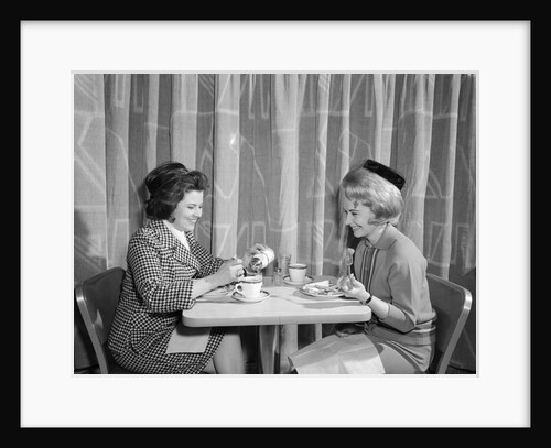 1960s two women having lunch in coffee shop restaurant by Anonymous