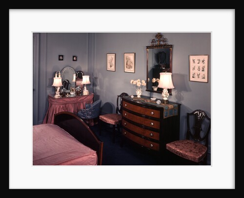 1930s 1940s bedroom with blue walls pink bedspread and skirted vanity table by Anonymous