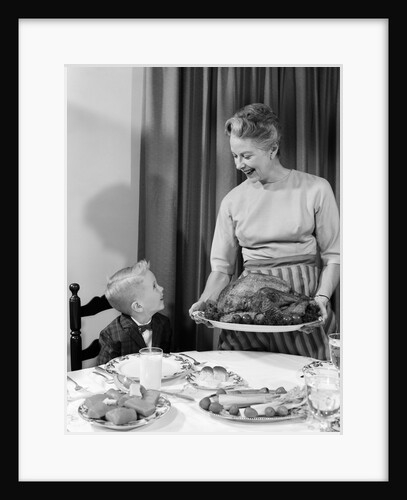 1960s grandmother grandson roast turkey thanksgiving dinner by Anonymous