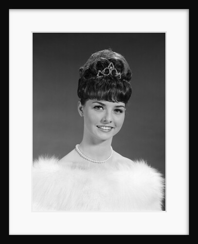 1960s pretty young woman wearing tiara fur stole and string of pearls looking at camera by Anonymous
