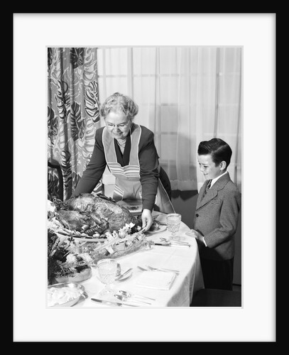 1950s grandmother grandson turkey thanksgiving dinner by Anonymous