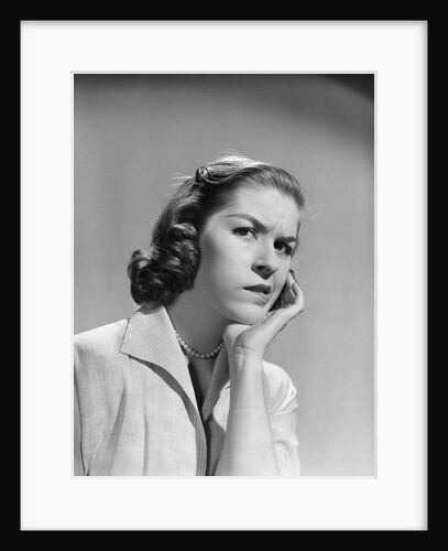 1950s 1960s woman portrait worried facial expression hand to cheek tooth pain by Anonymous