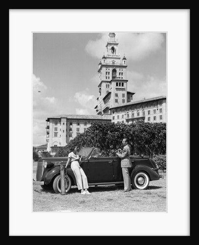 1930s couple with golf clubs standing by a car in front of the biltmore hotel miami florida by Anonymous