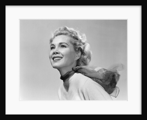 1950s 3/4 profile portrait smiling blond woman with wind blown hair and scarf by Anonymous