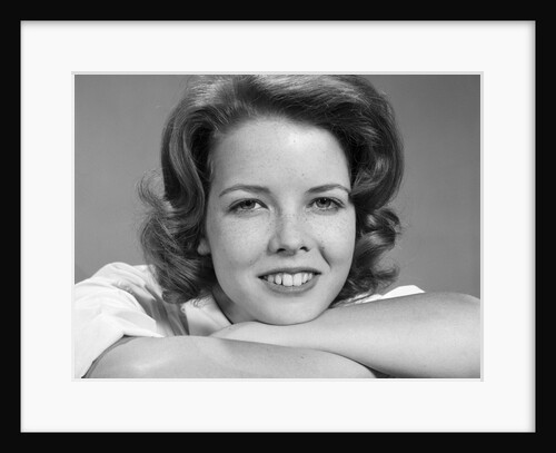 1960s smiling teen girl portrait arms folded looking at camera by Anonymous