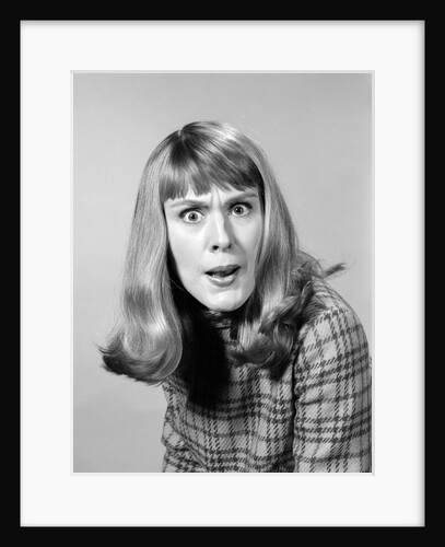 1960s head shot angry woman looking at camera by Anonymous