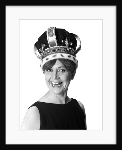 1970s smiling portrait woman wearing queen's crown looking at camera by Anonymous
