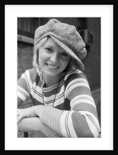 1970s portrait female in floppy wool cap and striped knit top looking at camera by Anonymous