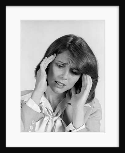 1980s portrait woman hands massaging temple forehead headache distress stress by Anonymous