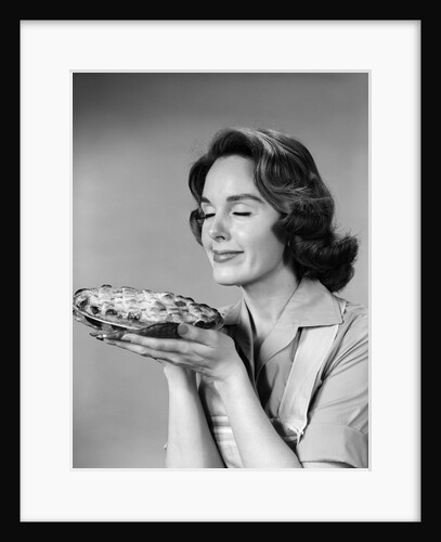 1950s 1960s woman smelling aroma of freshly baked pie by Anonymous