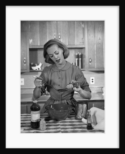 1960s woman baking in kitchen by Anonymous