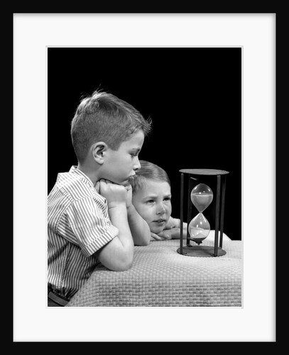 1940s two boys waiting watching sand falling in hourglass by Anonymous