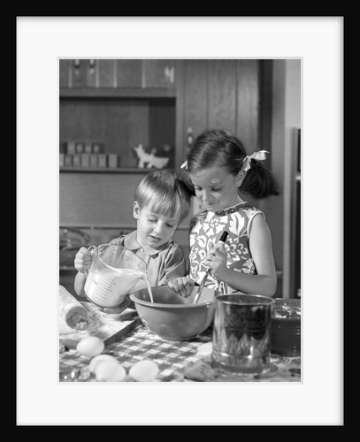 1960s two children boy girl bowl mixing pouring milk in kitchen by Anonymous