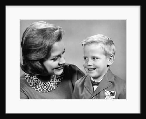 1960s portrait mother with arm around son dressed in school uniform with bow tie & emblem crest on jacket mom pearl lace collar by Anonymous