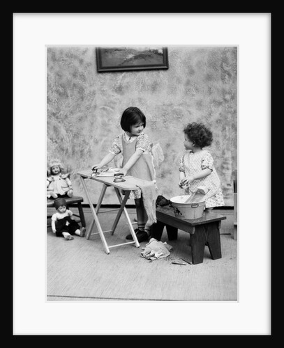 1920s two little girls playing ironing washing doll clothes by Anonymous