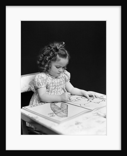 1960s 1940s girl child sitting at desk drawing coloring pictures by Anonymous