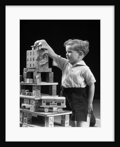 1930s boy playing with toys and building blocks by Anonymous