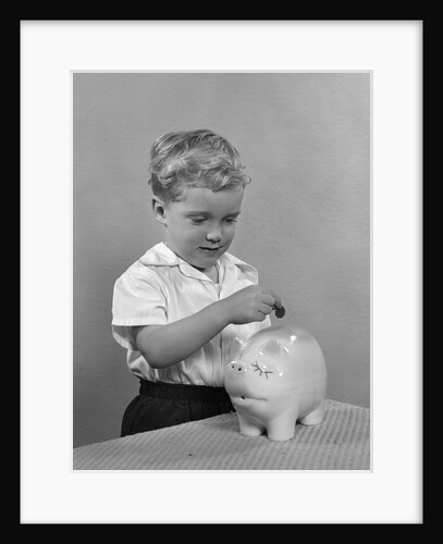 1950slittle boy putting coin into piggy bank by Anonymous