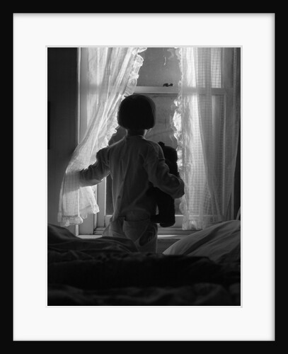 1920s child looking out window at night by Anonymous