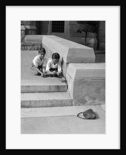 1930s two boys playing trick with string tied to lost purse by Anonymous