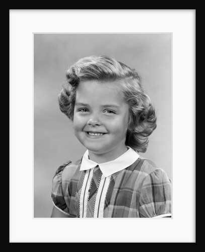 1950s portrait smiling girl with white collar plaid dress looking at camera by Anonymous