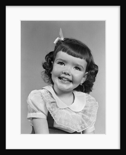 1950s smiling brunette girl with bangs by Anonymous