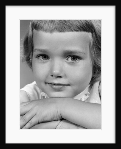 1960s young girl posing with arms near face by Anonymous