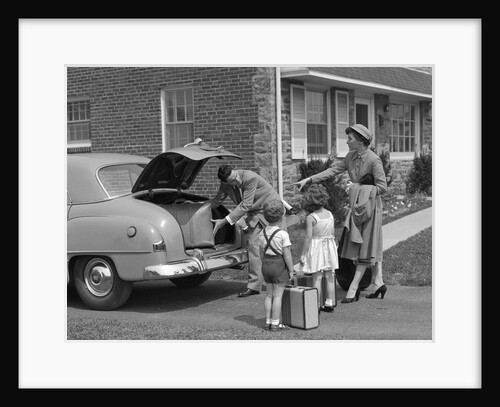 1950s family putting luggage suitcases into trunk of car by Anonymous