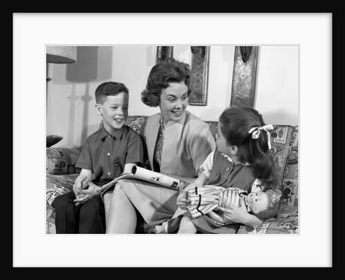 1960s mother sitting on couch with son and daughter by Anonymous