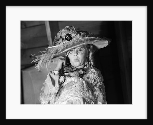 1950s girl play dress up in her mothers clothes hat glasses spectacles facial expression role playing age aging by Anonymous