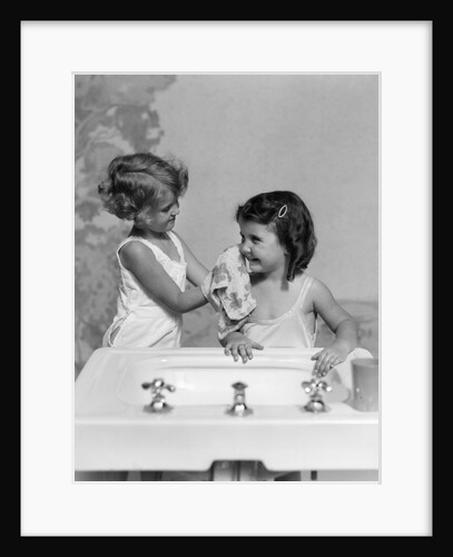 1930s two girls sisters at bathroom sink by Anonymous