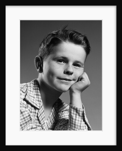 1950s child portrait boy with freckles posed resting head cheek on hand by Anonymous