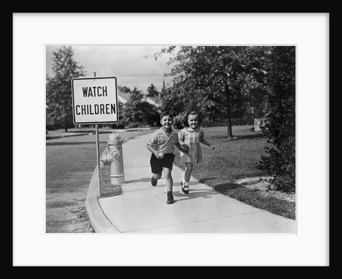 1950s children skipping walking on sidewalk watch children sign by Anonymous