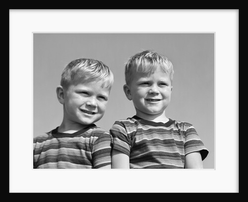 1950s portrait two twin blond boys smiling wearing striped tee shirts brothers by Anonymous