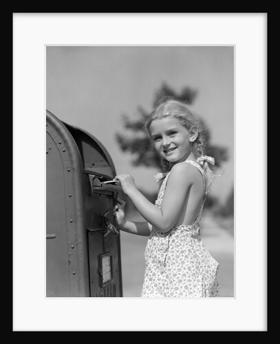 1930s 1940s child blond little girl with pigtails putting letter into mail box, looking at camera by Anonymous