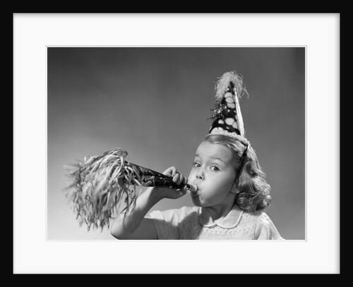1950s girl wearing party hat blowing into noise maker looking at camera by Anonymous
