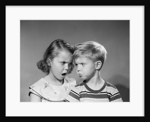 1950s boy girl head to head angry facial expressions argument fight by Anonymous