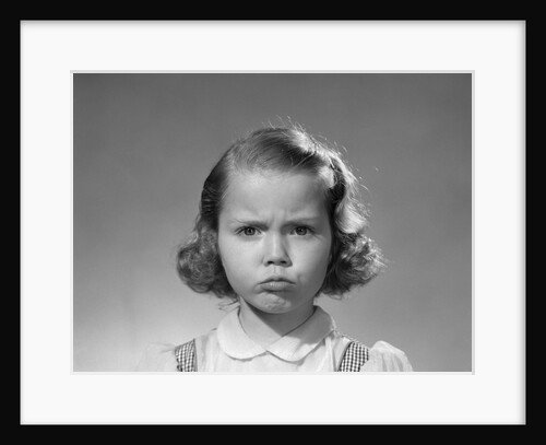 1950s portrait sad serious girl making grumpy angry pouting facial expression looking at camera by Anonymous