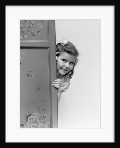 1940s child smiling little girl peeking around painted folding screen by Anonymous
